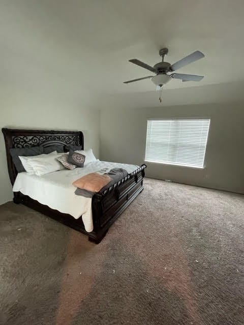 carpeted bedroom featuring ceiling fan