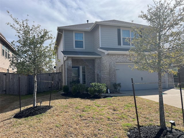 front of property with a front lawn and a garage