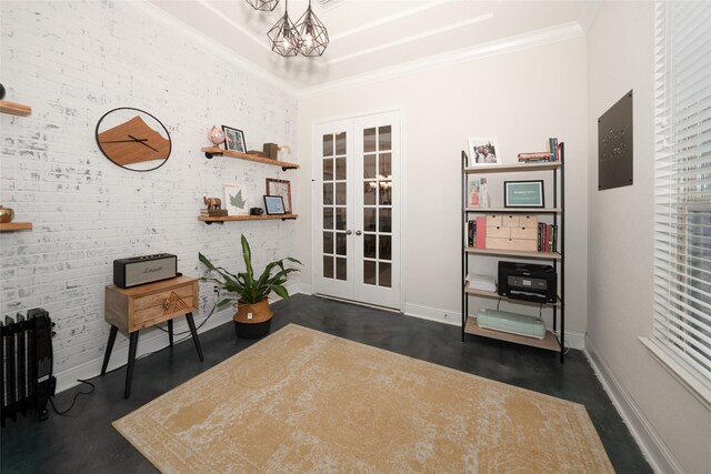 misc room featuring an inviting chandelier, crown molding, brick wall, and french doors