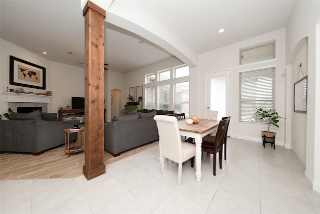 dining area featuring decorative columns