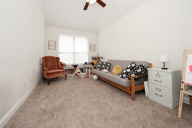 sitting room featuring ceiling fan, light colored carpet, and lofted ceiling