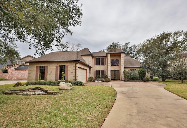 view of front of house with a front lawn and a garage