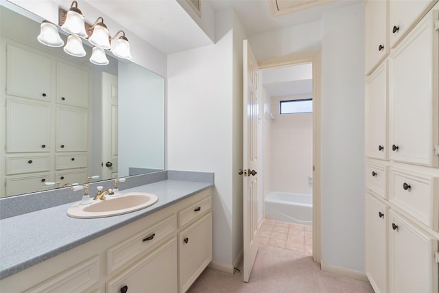 bathroom featuring tile patterned flooring and vanity