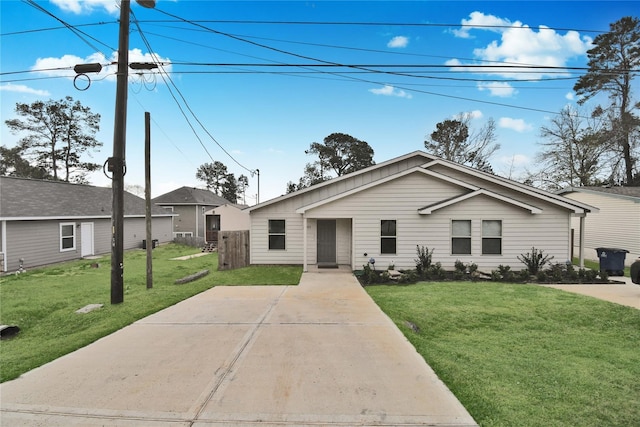 ranch-style house with a front lawn