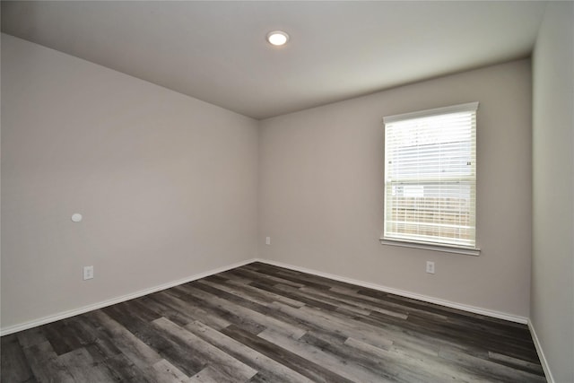 empty room featuring dark wood-type flooring