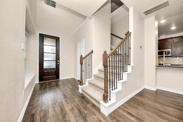 entrance foyer featuring dark wood-type flooring