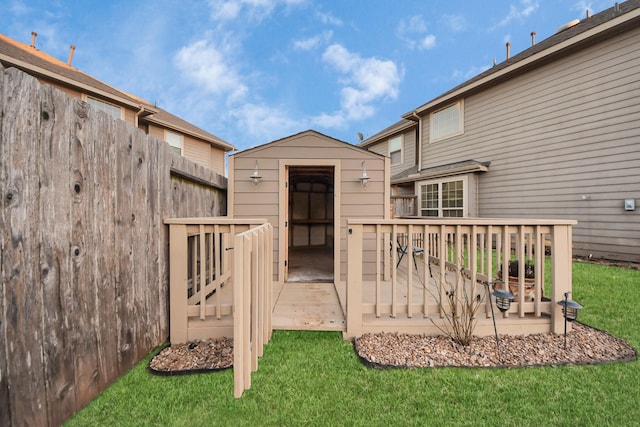 exterior space featuring a lawn and a deck