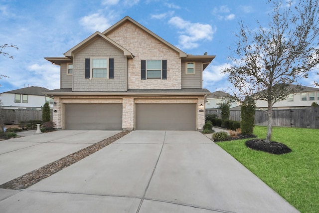 view of front of property featuring a garage and a front lawn