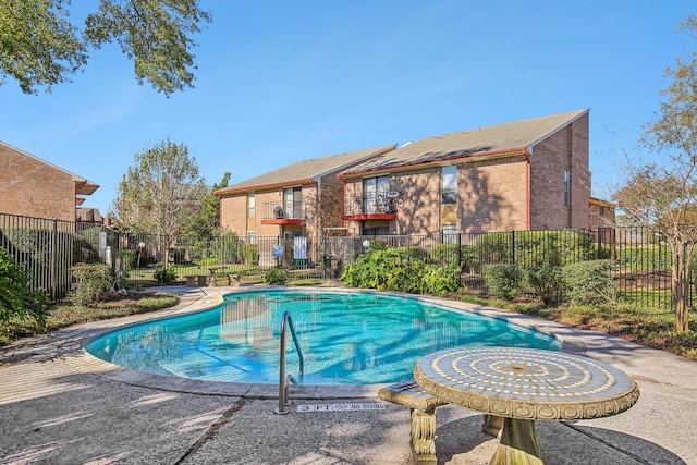 community pool featuring fence