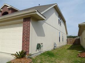 view of side of home featuring a yard