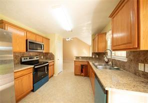 kitchen with decorative backsplash, stainless steel appliances, and sink