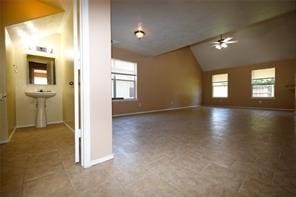 interior space featuring plenty of natural light and lofted ceiling