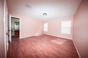 spare room featuring dark hardwood / wood-style floors