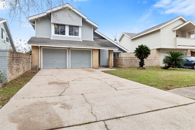 view of front property featuring a garage and a front lawn