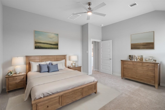 carpeted bedroom with ceiling fan and vaulted ceiling