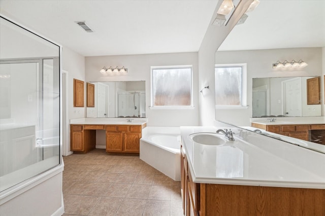 bathroom with tile patterned floors, vanity, and plus walk in shower