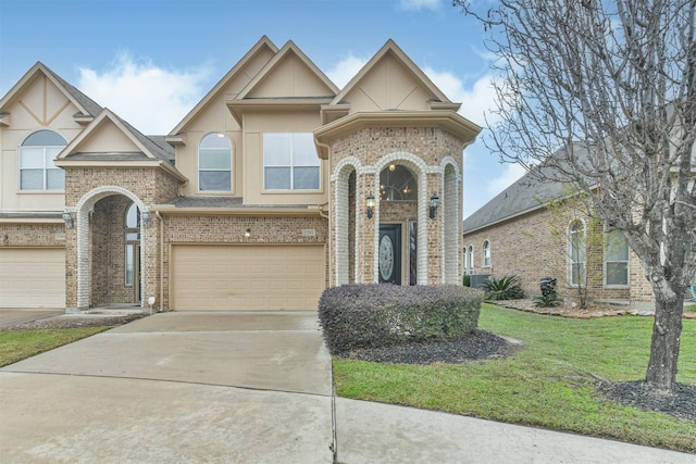 view of front of home featuring a front lawn and a garage