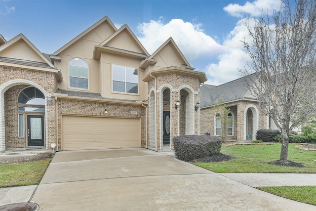 view of front of property with a front lawn and a garage