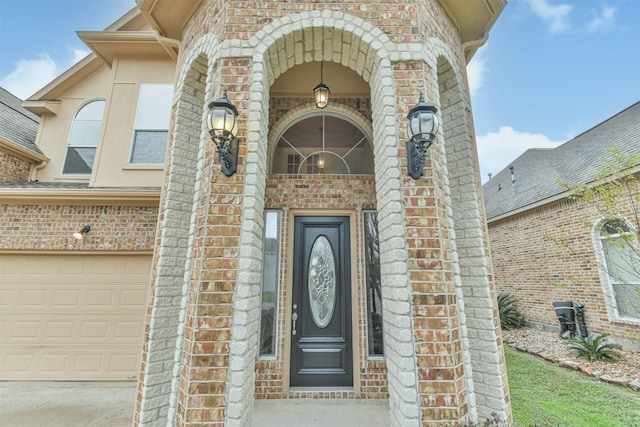 doorway to property featuring a garage