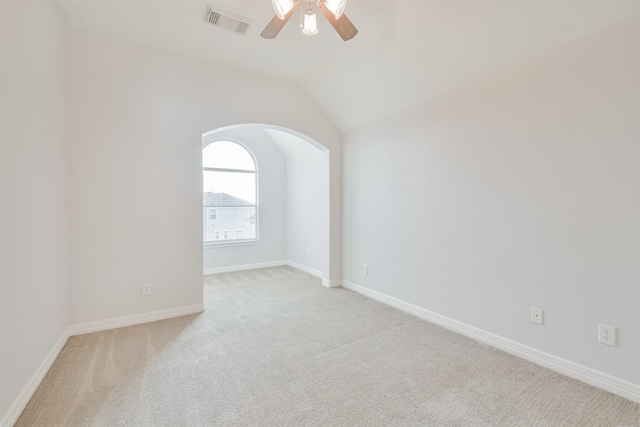 carpeted empty room with lofted ceiling and ceiling fan