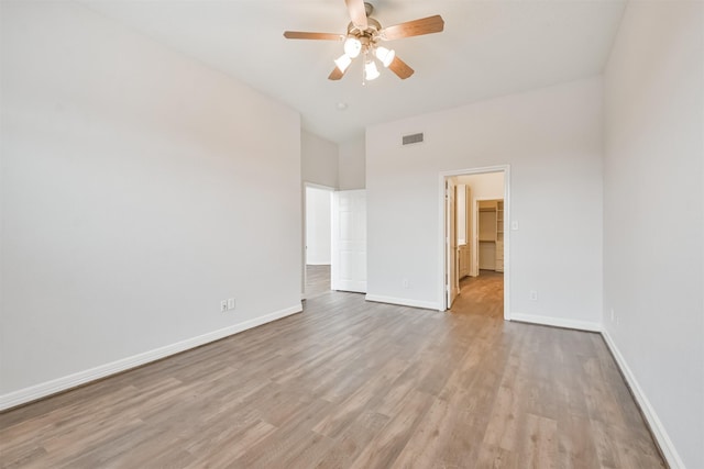 unfurnished room featuring light wood-type flooring and ceiling fan