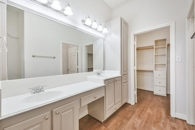 bathroom featuring vanity and hardwood / wood-style flooring