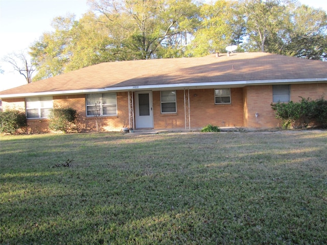 ranch-style home with a front yard