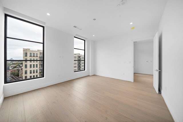 2323 San Felipe St Unit 803, Houston, TX 77019 - empty room with light hardwood / wood-style flooring