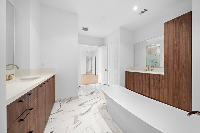 bathroom featuring separate shower and tub and vanity