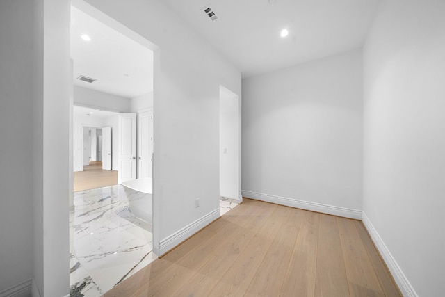 spare room with light wood-type flooring