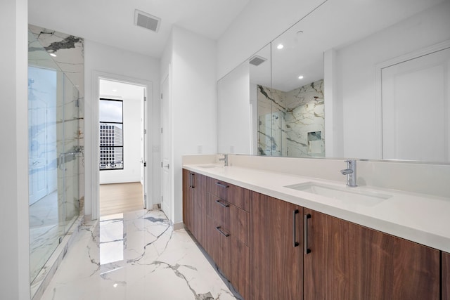 bathroom featuring vanity and a shower with door