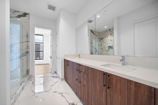 2323 San Felipe St Unit 803, Houston, TX 77019 - bathroom featuring vanity and a shower with door