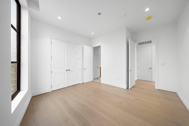 unfurnished bedroom featuring light hardwood / wood-style flooring