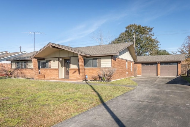 ranch-style house featuring a front lawn and a garage