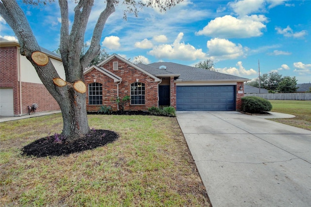 ranch-style home featuring a garage and a front lawn