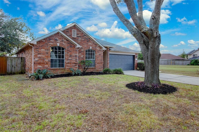 view of front facade featuring a garage and a front lawn