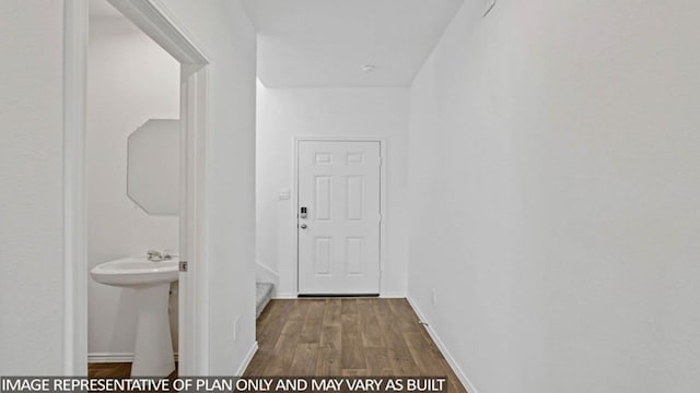 hallway featuring wood-type flooring