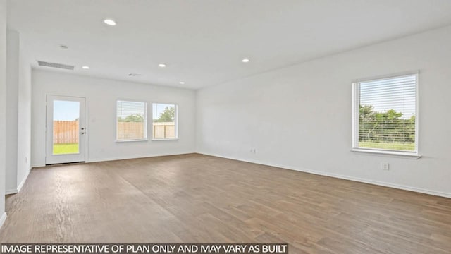 unfurnished room with light hardwood / wood-style flooring