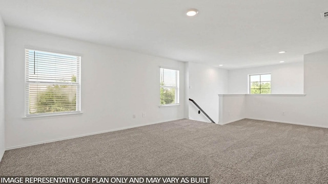 unfurnished room with light colored carpet