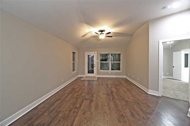 spare room with ceiling fan, dark hardwood / wood-style floors, and lofted ceiling