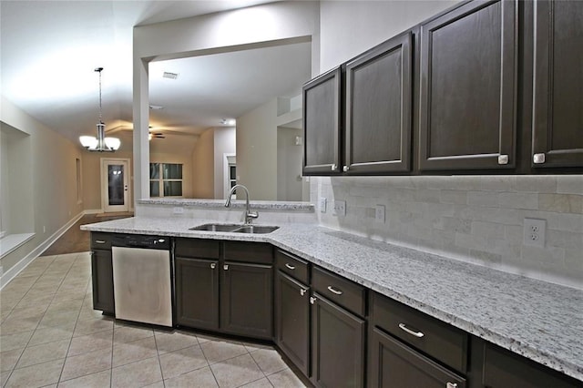 kitchen featuring dishwasher, dark brown cabinetry, light tile patterned floors, and sink