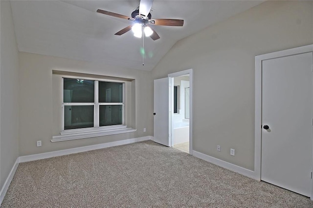 interior space with light carpet, ceiling fan, and lofted ceiling