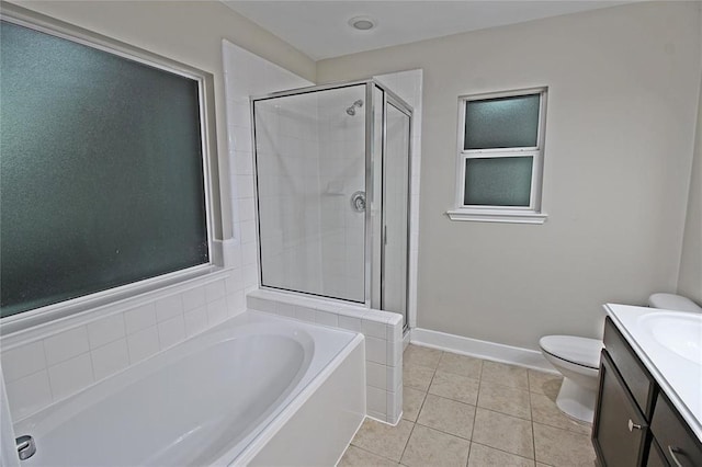 full bathroom with tile patterned flooring, shower with separate bathtub, vanity, and toilet