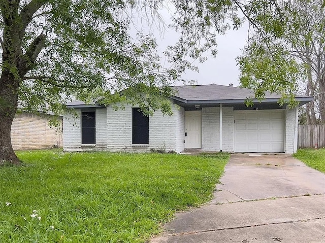 single story home featuring a front yard and a garage