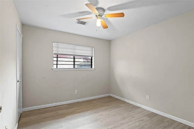 unfurnished room with ceiling fan and light hardwood / wood-style flooring