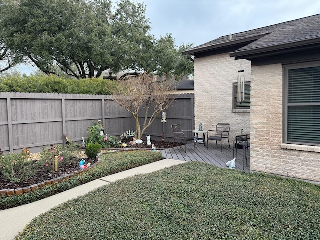 view of yard featuring a wooden deck