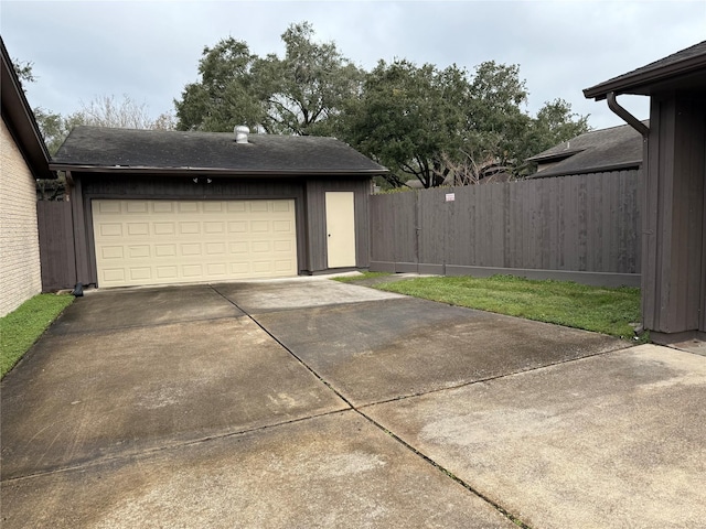 garage featuring a yard