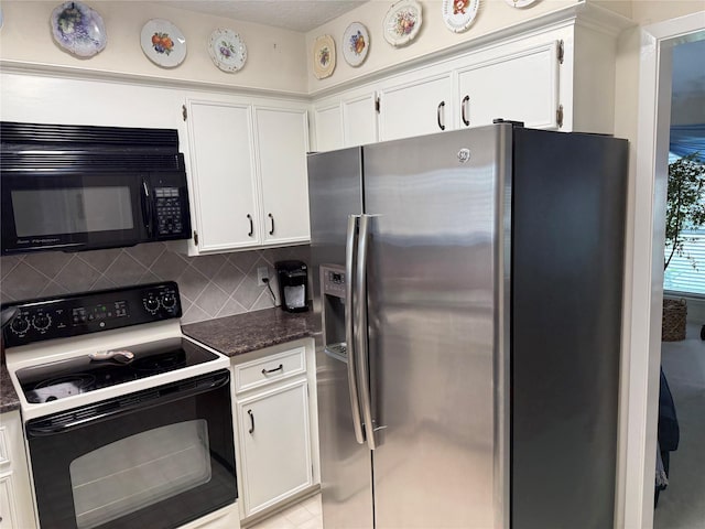 kitchen with white cabinets, tasteful backsplash, dark stone countertops, and black appliances