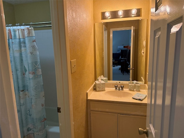 bathroom featuring vanity and shower / tub combo