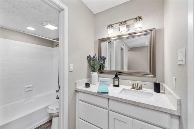 full bathroom with toilet, shower / bath combination, a textured ceiling, and hardwood / wood-style flooring